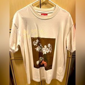 A cream colored medium shirt from PacSun